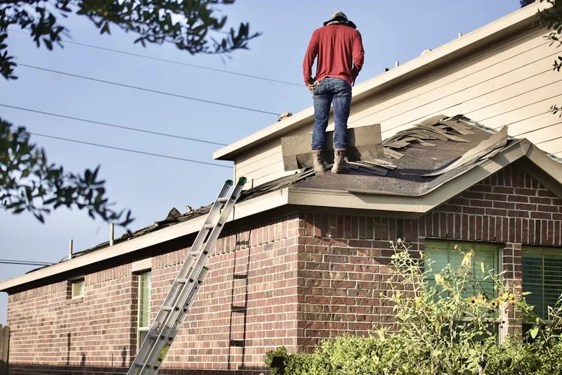 Professional roofer working on a residential roof in Morgan Fair Corners